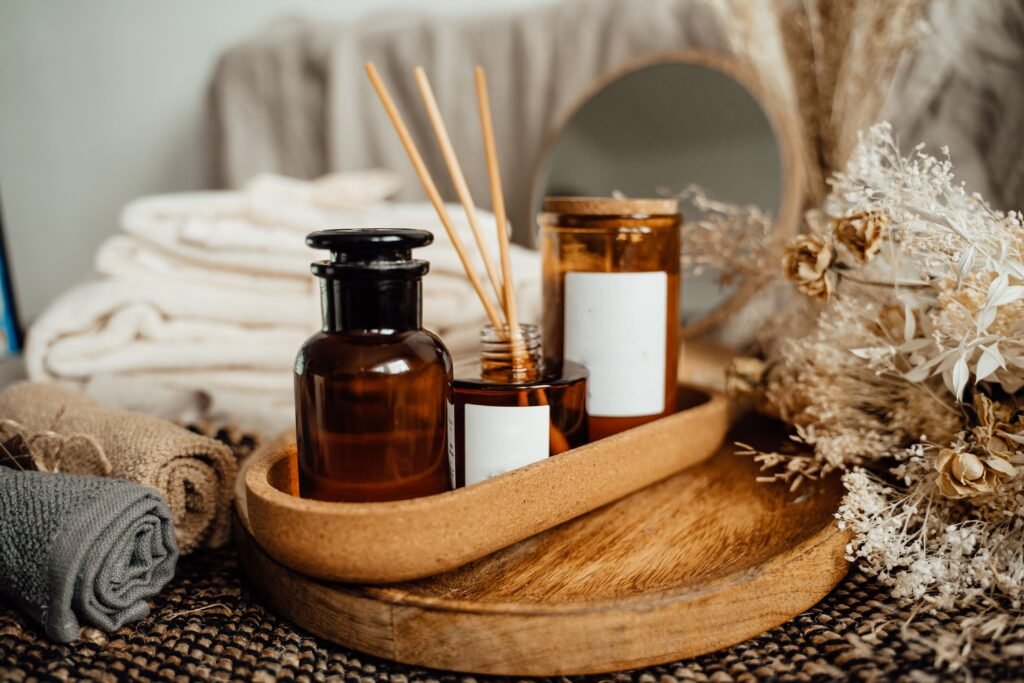 bottles of fragrances and rustic wood-plate