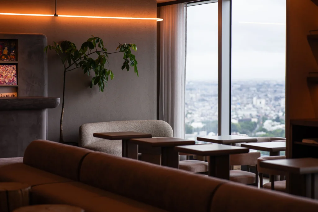 a sofa and table in a cozy room with city view