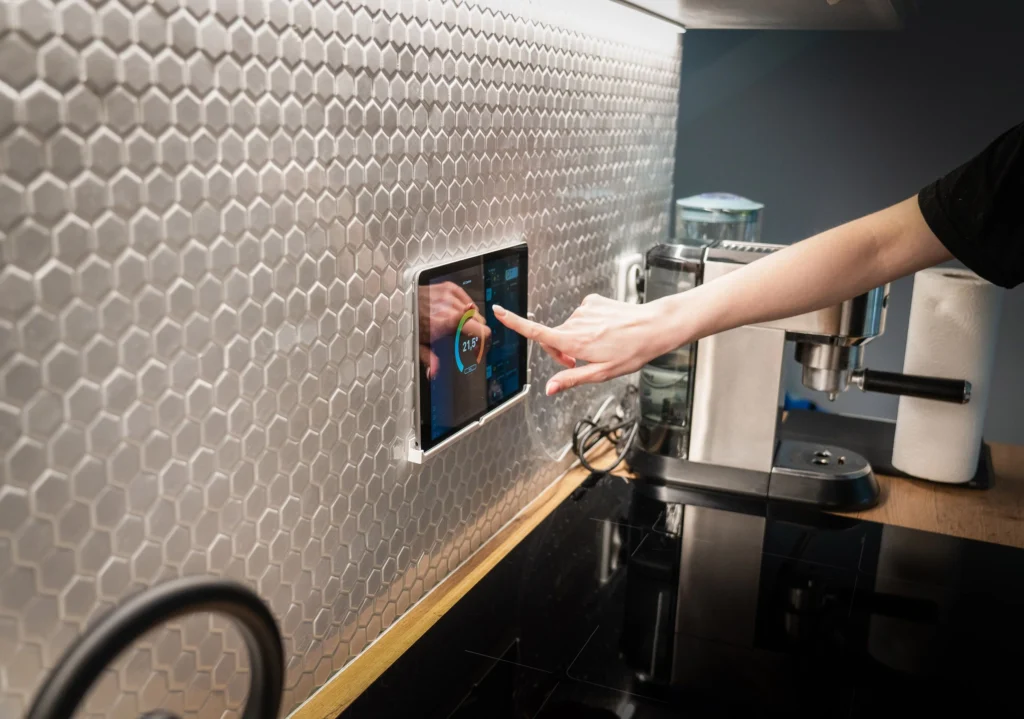 someone using tablet to setting up room temperature